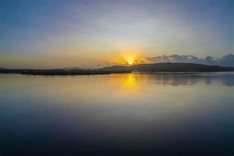 Hazy Sunrise Waterscape With Reflections Stock Photo Image Of Hazy