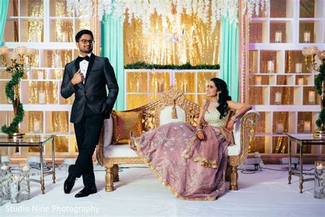 indian bride and groom posing at wedding reception stage indian bride and groom indian