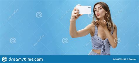 Outgoing And Self Assured Glamorous Woman Like Taking Pictures Of Herself Holding Smartphone
