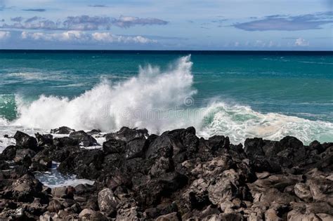 Wave Breaking On Black Lava Rock In Hawaiiwhite Spray In The Air