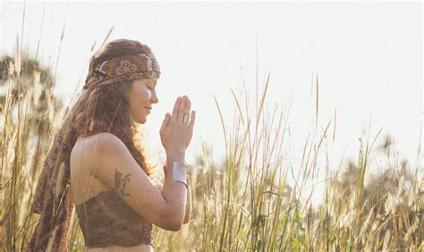 Hippie Woman Praying In Nature By Visualspectrum Stocksy United