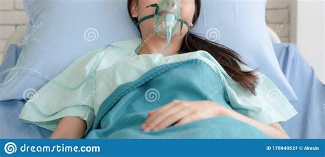 Asian Woman Patient On Bed In Hospital With Wearing Oxygen Mask Stock Image Image Of Nebuliser