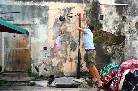Much photographed are his 'children. Discovering Street Art, Clan Jetties, Hashing, & Food in ...