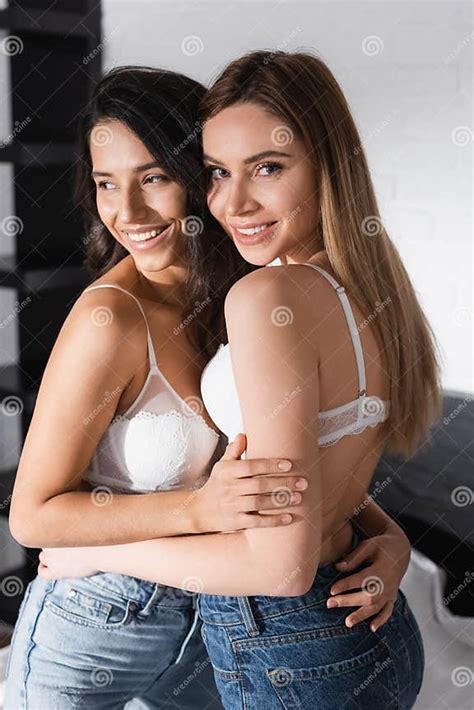 Smiling Lesbian Couple In White Bras Stock Image Image Of Denim Emotion 216522943