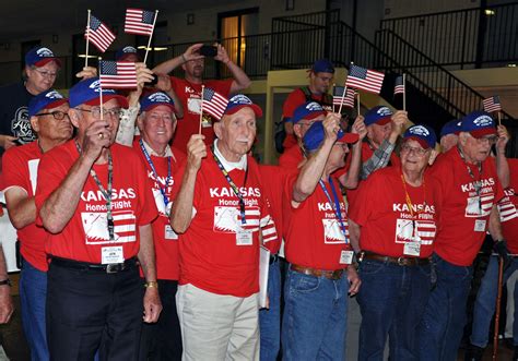 Wwii And Korean War Veterans Take In Applause From The Crowd During An