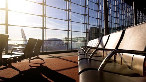 Waiting Room In Airport Terminal With Empty Seats Under Morning Sunrays