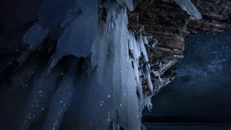 Rotating Star Sky At Night View Through Ice Cave 4k Time Lapse Stock