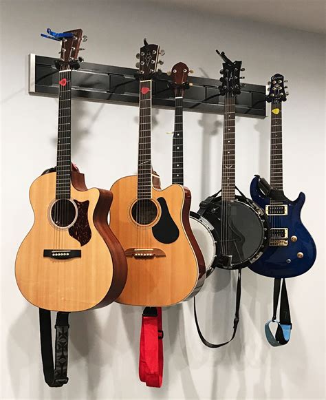 Guitar hanging system used in home for guitar storage and display | Guitar hanger, Diy guitar ...