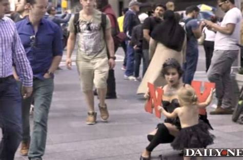 mother brings topless 2 year old daughter to panhandle around times square