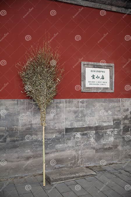 Chinese Broom Against A Red Wall At The Palace Editorial Photo Image