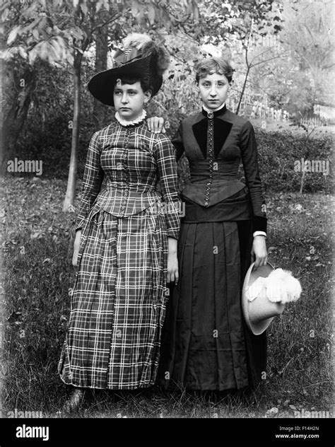 1890 1890s Portrait Two Teenaged Girls Standing In Backyard Lawn One