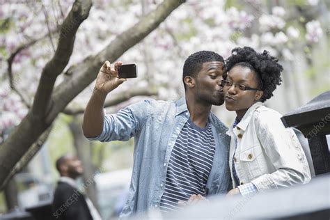 A Man And Woman Taking A Selfie Stock Image F Science
