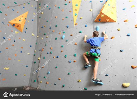Young Boy Climbing Wall Stock Photo By ©belchonock 175184852