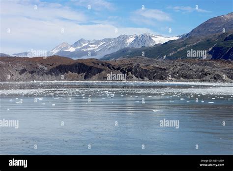 Ice Floating On Lake Surface With Mountains In Background In Alaska