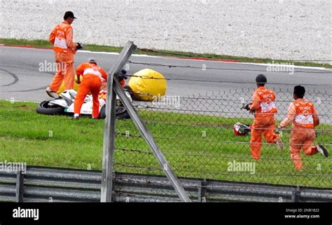 Race Marshal Gather Around The Motorcycle Of Italys Rider Marco