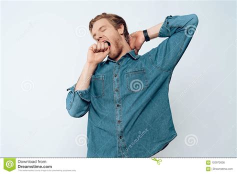 Portrait Of Tired Sleepy Young Man Yawning Stock Photo Image Of