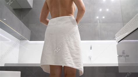 woman entering the shower and dropping her towel stock video footage 10932250