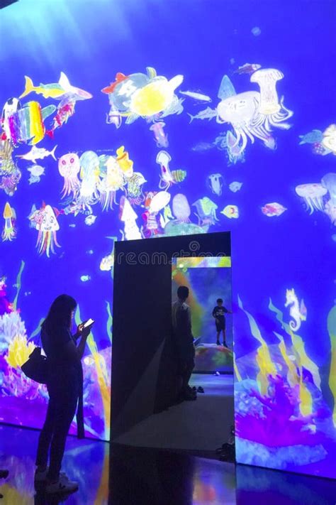 Visitors Walking Inside The Artscience Museum Singapore While Looking