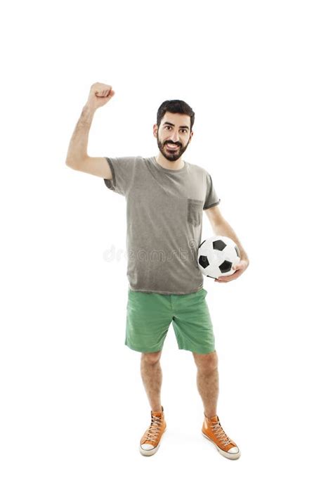 Young Man Holding Soccer Ball In Hand He S Happy And Looking At Camera