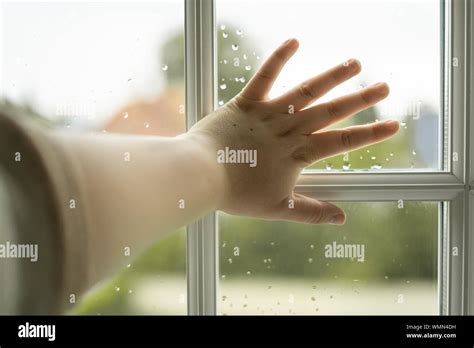 Hand Against Window Stock Photo Alamy