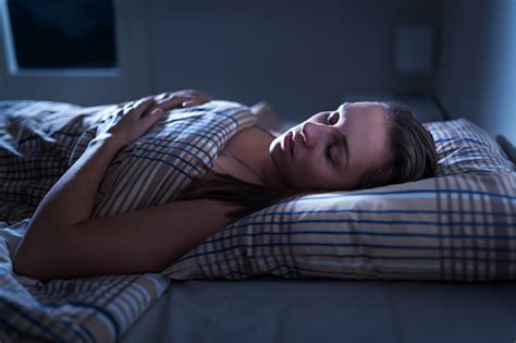 Calm And Peaceful Woman Sleeping In Bed In Dark Bedroom Lady Asleep At