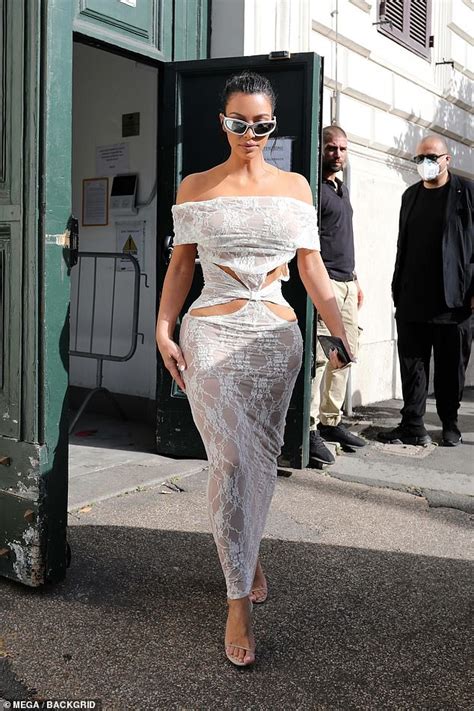 Kim Kardashian Shows Off Her Sensational Curves In A White Lace Dress As She