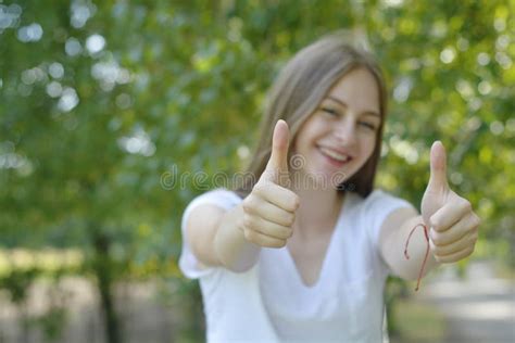 Young Teen Age Girl Showing Happy Thumbs Up Gesture With Hand