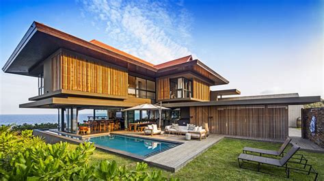Coastal Home With Tropical Modern Architecture And Eclectic Interior
