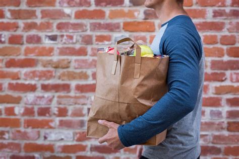 Mid Section Of A Man Carrying Stock Photo Pixeltote