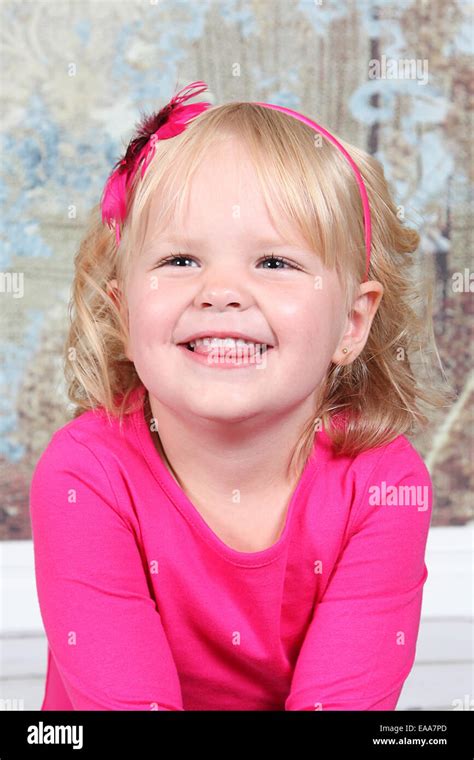 Beautiful Little Girl Posing For Camera In Studio Stock Photo Alamy