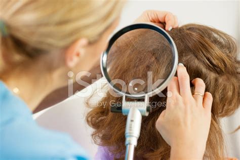 Woman Inspect Childs Head For Lice Stock Photo Royalty Free Freeimages