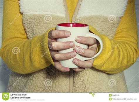 A Woman Holds A Hot Cup Of Tea And Warms His Hands Stock Image Image