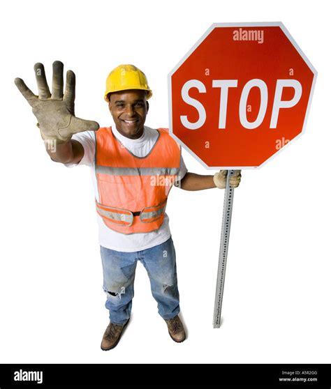 Road Worker With Stop Sign And Hardhat Stock Photo Alamy