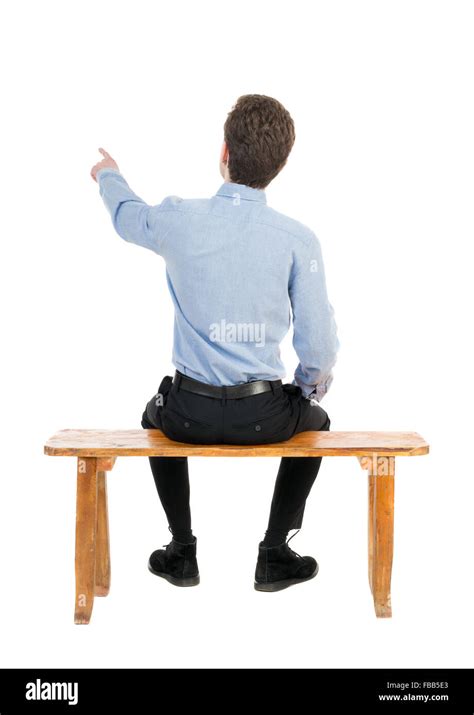 Back View Of Business Man Sitting On Chair And Pointing Businessman