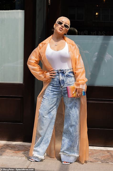 Christina Aguilera Oozes Cool In A Long Orange Jacket And Light Wash