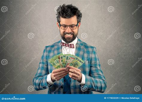 Greedy Smiling Girl Looking Cunning And Holding Money Standing White