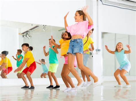 Happy Sporty Kids Jumping In Modern Dance Studio Stock Image Image Of