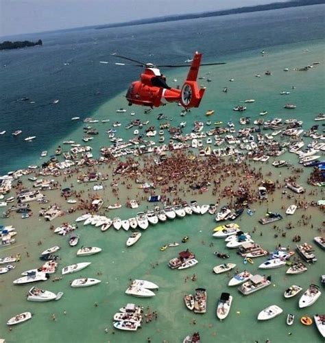 lawsuit filed to stop massive torch lake sandbar parties torch lake sandbar party grand lake
