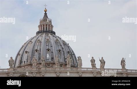 The St Peters Basilica Dome And Apostles Stone Statues In Vatican City