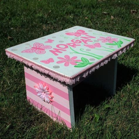 Toddler size wooden step stool that is painted a solid ... It angles out slightly from the top to the base.