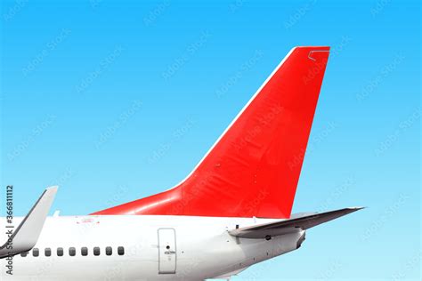 Modern Airplane Tail Side With White Aircraft Body Red Fin And White