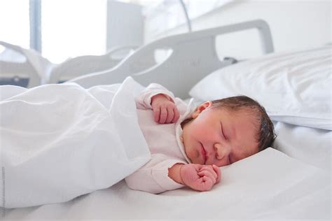 First Days Of A Newborn Baby Girl Sleeping In Hospital Room By Stocksy