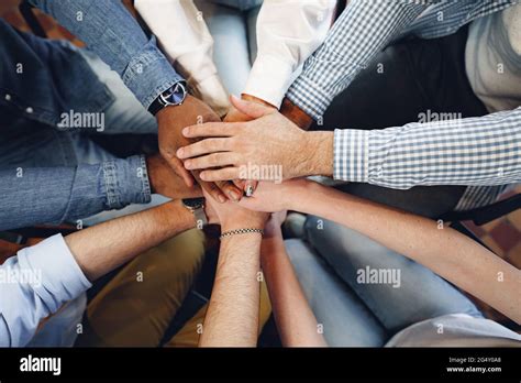 Top View Of Diverse People Hands Holding Together In Circle Hands