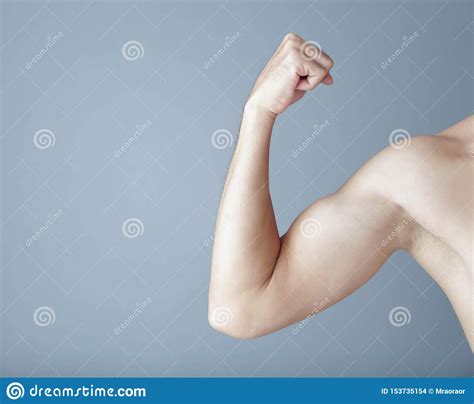 Man Arm With Muscle On Grey Background Health Care And Medical Concept