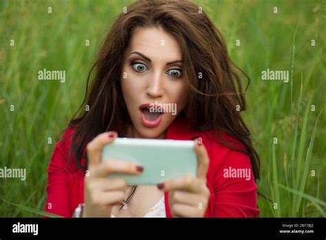 Wow Shocking News By Phone Happy Woman In Shock Looking At Mobile Phone Texting Surprising