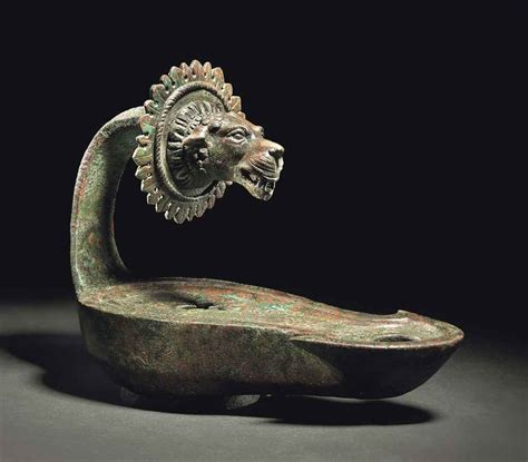 Usually made of stone or clay, they were the while letters were common in the roman period, other symbols like the footprint were also very popular. A ROMAN BRONZE LAMP , CIRCA 2ND CENTURY A.D. | Christie's