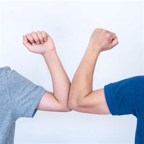 Elbow Bump Stock Photos Pictures And Royalty Free Images Istock