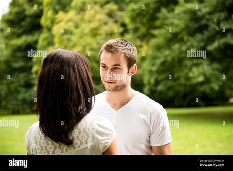 Young Happy Couple Looking On Each Other Outdoor Lifestyle Portrait