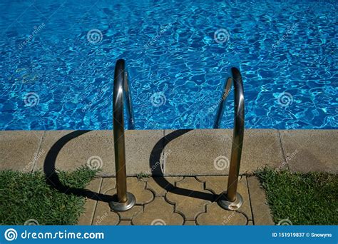Stainless Steel Handrail Stair Of Swimming Pool With Shadows Stock