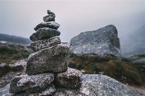 Human Made Pile Of Stones Cairn As Way Marker In Foggy Mountain Stock Photo Image Of Calm